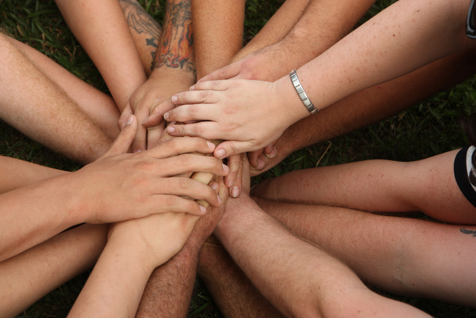 Hands together as a sign of group unity