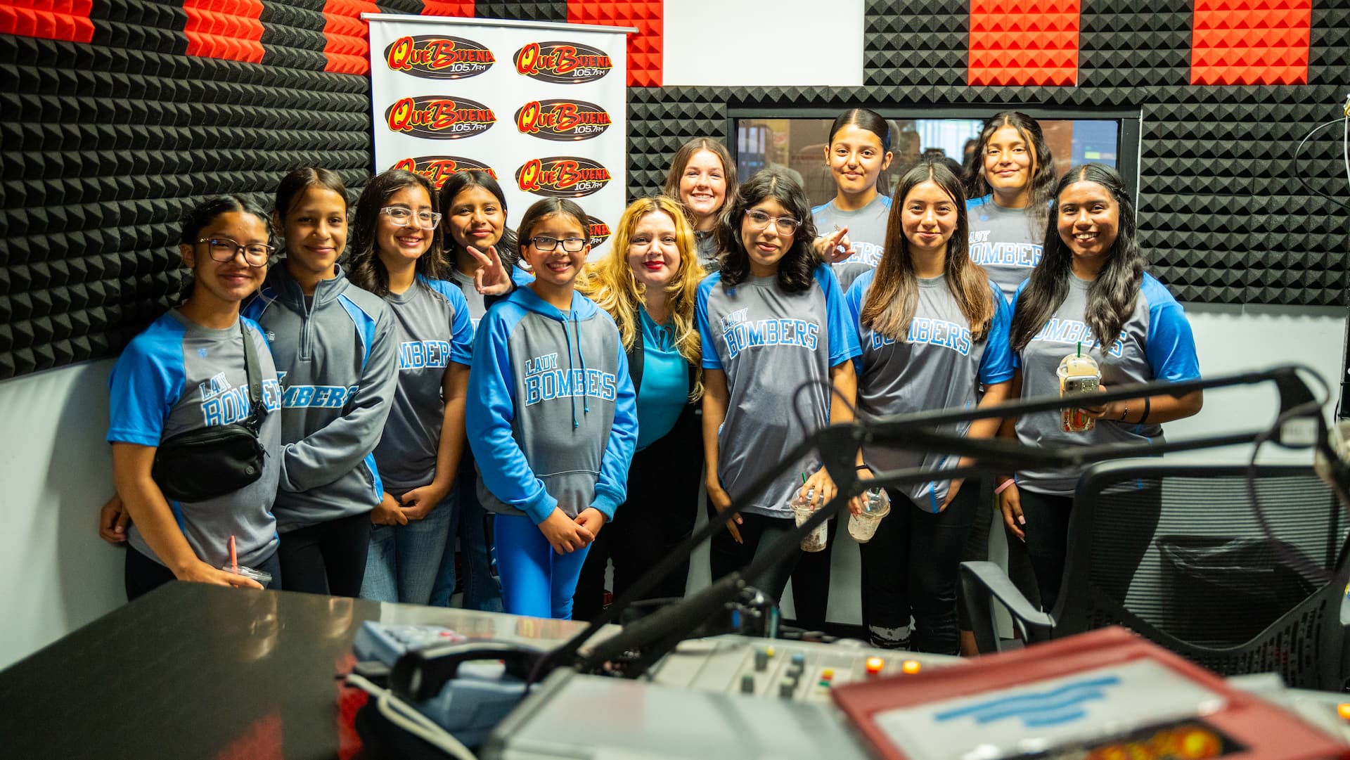 youngs at radio station taking a photo with host